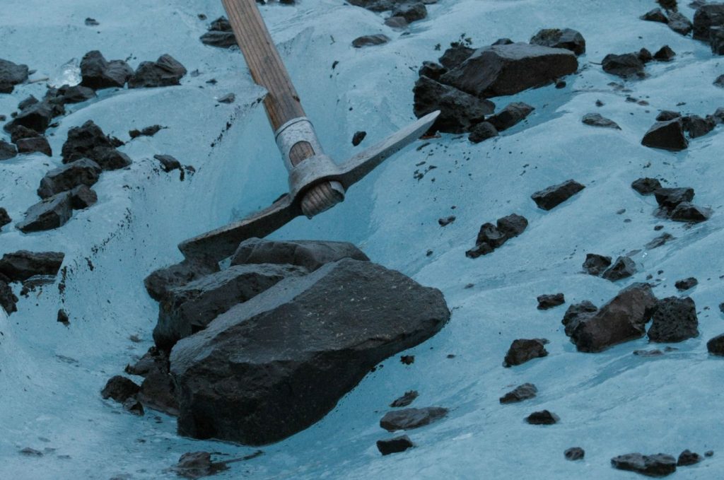 An ice axe driven into glacier ice at Skaftafell