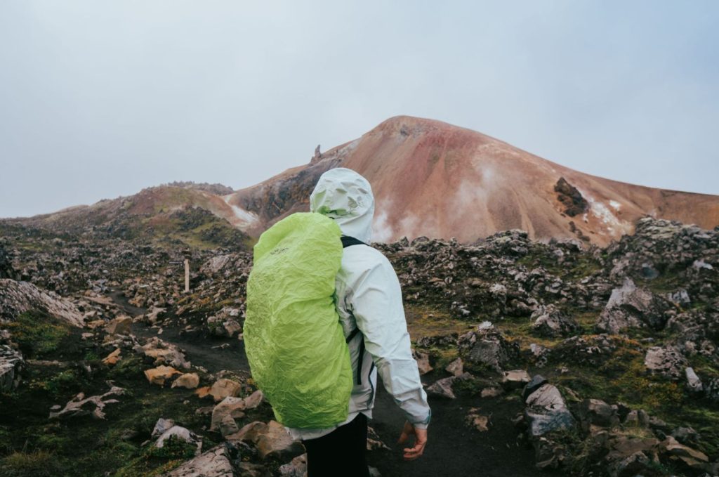 A walker in the rhyolite landscape of Landmannalaugar