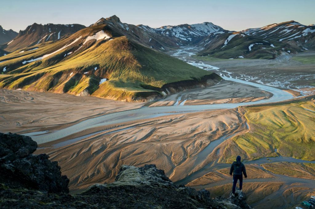 A walker above a braided river, Landmannalaugar