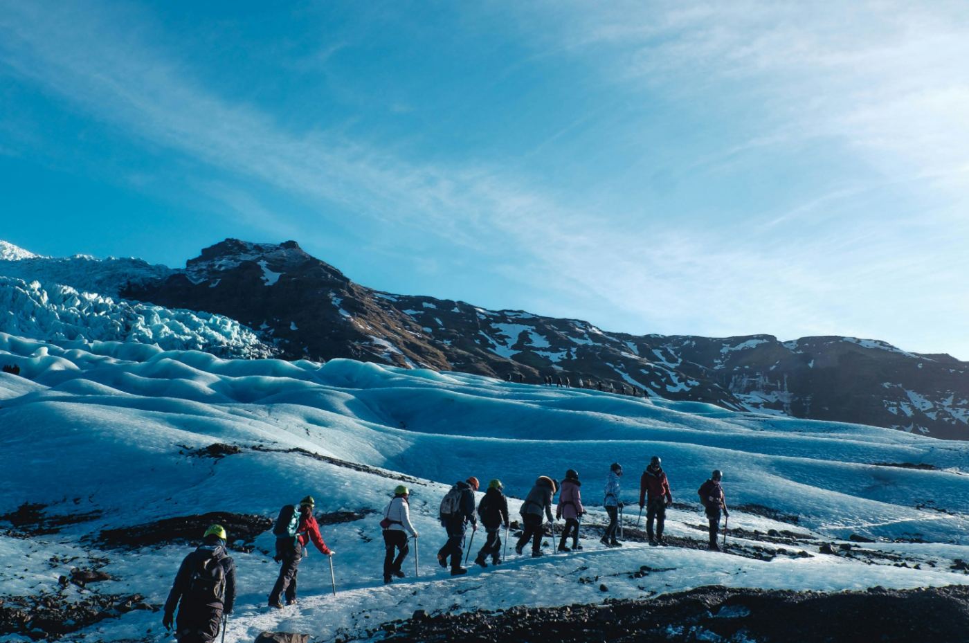A group walking up a snowy slope of Vatnajökull