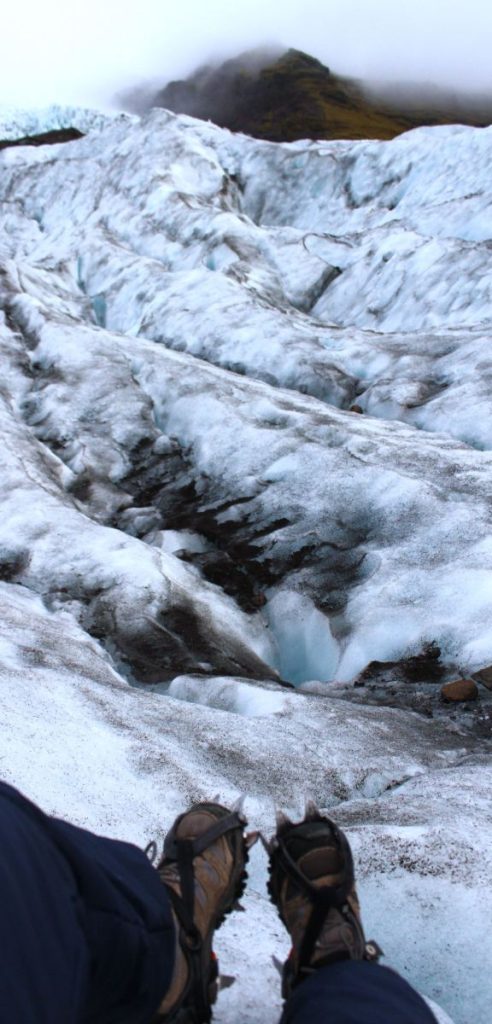 Crampons on glacier ice · Brianna Eisman