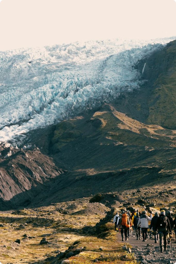 Walkers approaching the glacier at Skaftafell, Iceland.
